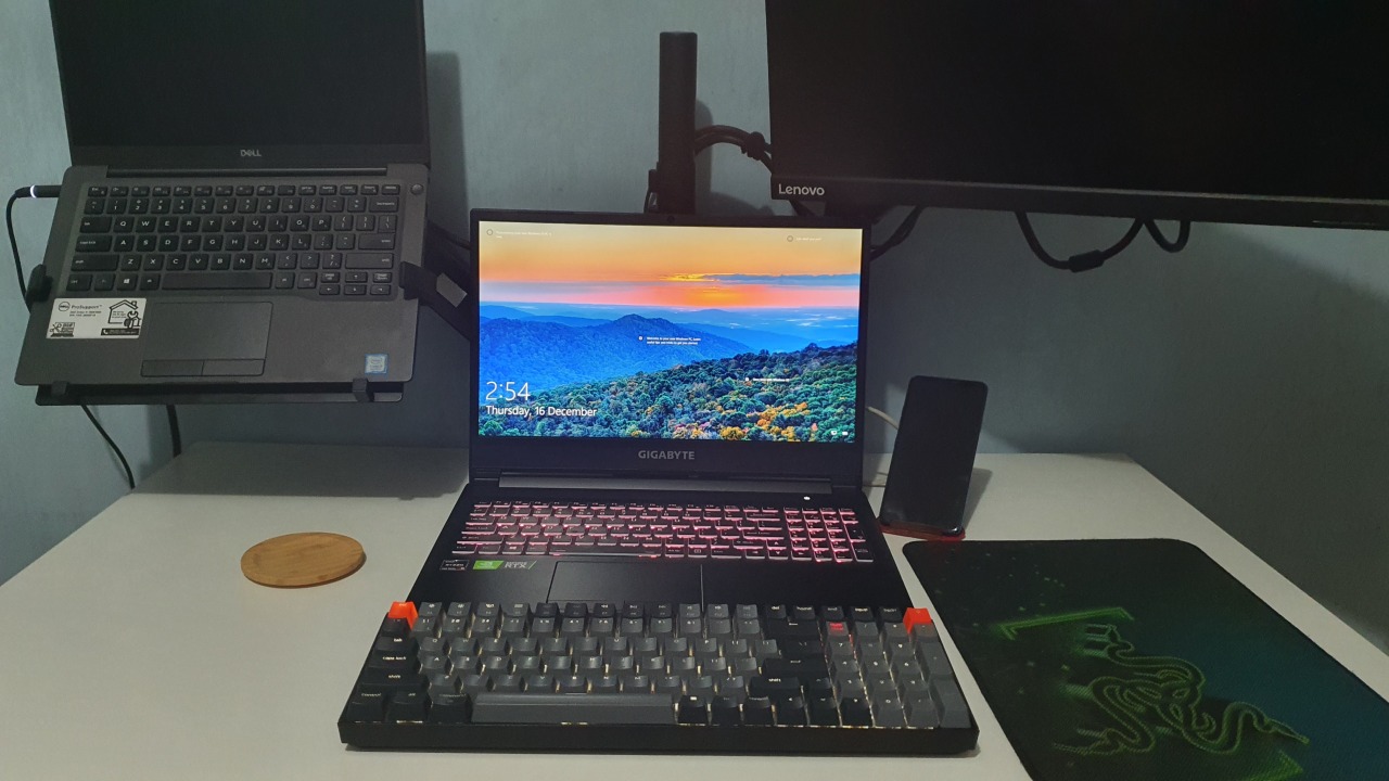 Gigabyte A5 X1 Laptop powered by Ryzen 9 CPU 5900HX and GeForce RTX 3070P. Overall the laptop experience is very good and smooth especially on games and video content creation. As for all the laptops I've touched I had to use a mechanical keyboard for use. In this picture I've used Keychron K4 mechanical keyboard.